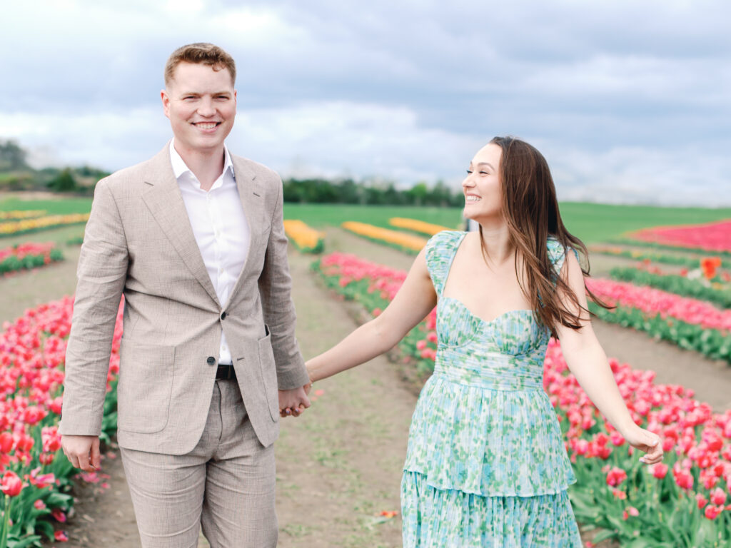 Anne & Elijah gathering flowers in the tulip fields in full Bloom at Burnside Farms