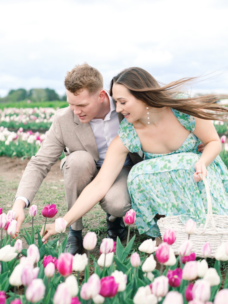 Anne & Elijah gathering flowers in the tulip fields in full Bloom at Burnside Farms